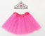 Pink tutu skirt with tiara for party decor, ideal for birthday or celebration decorations, includes balloons and party hats.