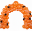 Party Paradise Store orange matte latex balloon arch decorated with artificial spider webs and black plastic spiders