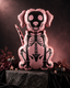Party Paradise Store dog skeleton inflatable balloon in pink with black bone details for Halloween party decor