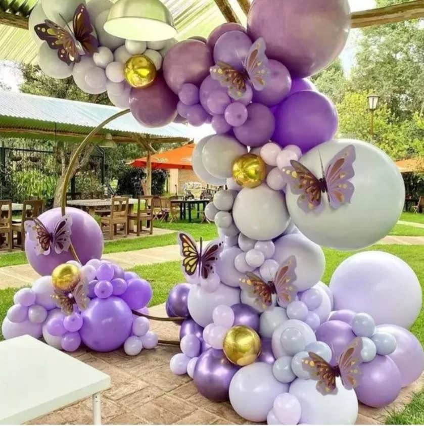 Purple balloon garland with butterflies, ideal for themed party decor, birthday party, or wedding decorations.