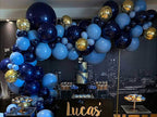 Retro Navy Blue, Matte Light Blue 106 pcs party decorations setup with balloon garland, cake, and party tableware for birthday celebration.