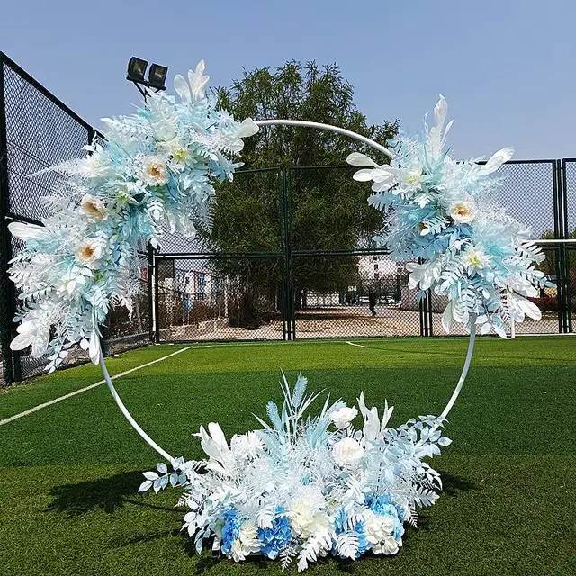 Round Metal Arch Backdrop Stand in Gold for party decorations, balloons, themed events, and celebrations in outdoor setting.