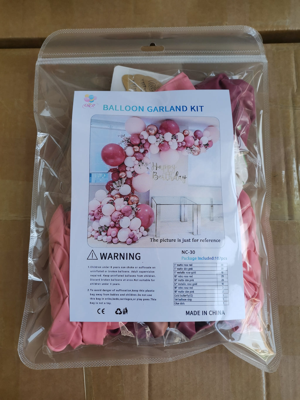 Balloon garland kit in Retro Rose Skin Pink for party decorations and themed celebrations.