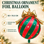 Party Paradise Store Christmas ornament foil balloon with red and green stripes and a gold bow for holiday decor.