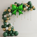 Party Paradise Store green bow balloon arch with gold and white accents for Christmas holiday party decorations