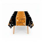 Party Paradise Store rectangular Halloween table cover with orange spiderweb center and black sides featuring ghosts