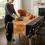 Party Paradise Store rectangular Halloween table cover with orange and black spiderweb and pumpkin print