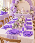 Party Paradise Store lavender purple disposable tableware set for 20 guests including plates, cups, napkins, and cutlery.