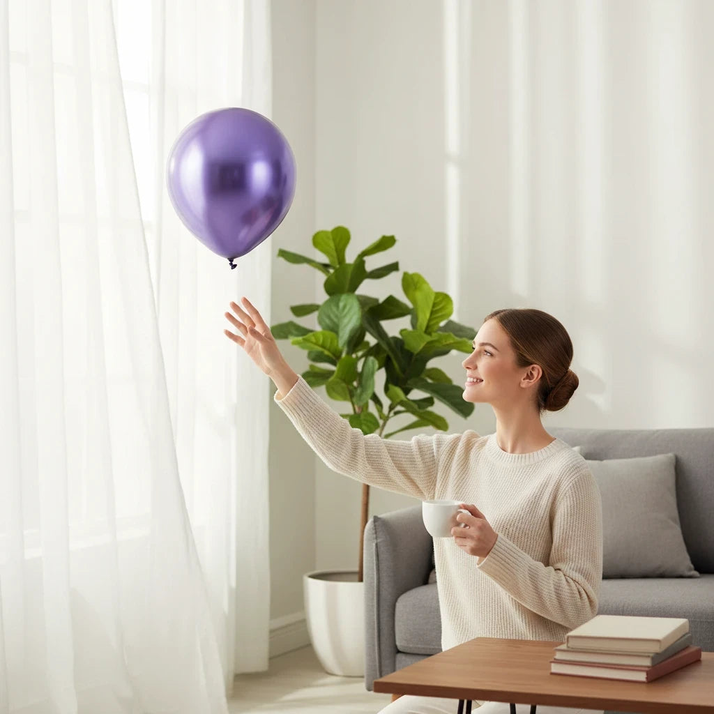 Party Paradise Store purple chrome latex balloon floating near a woman in a bright living room