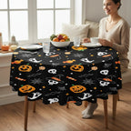 Party Paradise Store round Halloween tablecloth with jack-o'-lanterns, ghosts, and skulls on a black background.