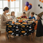 Party Paradise Store round Halloween tablecloth with jack-o'-lanterns, ghosts, and skulls on a family dining table.