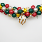 Party Paradise Store white gold Christmas ornament balloon hanging from a festive holiday balloon garland arch