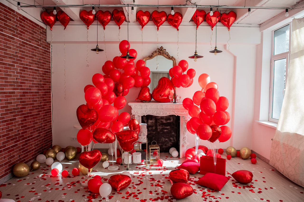 Red heart-shaped balloon decor for romantic themed party, ideal for weddings or Valentine's Day celebrations, enhancing event ambiance.